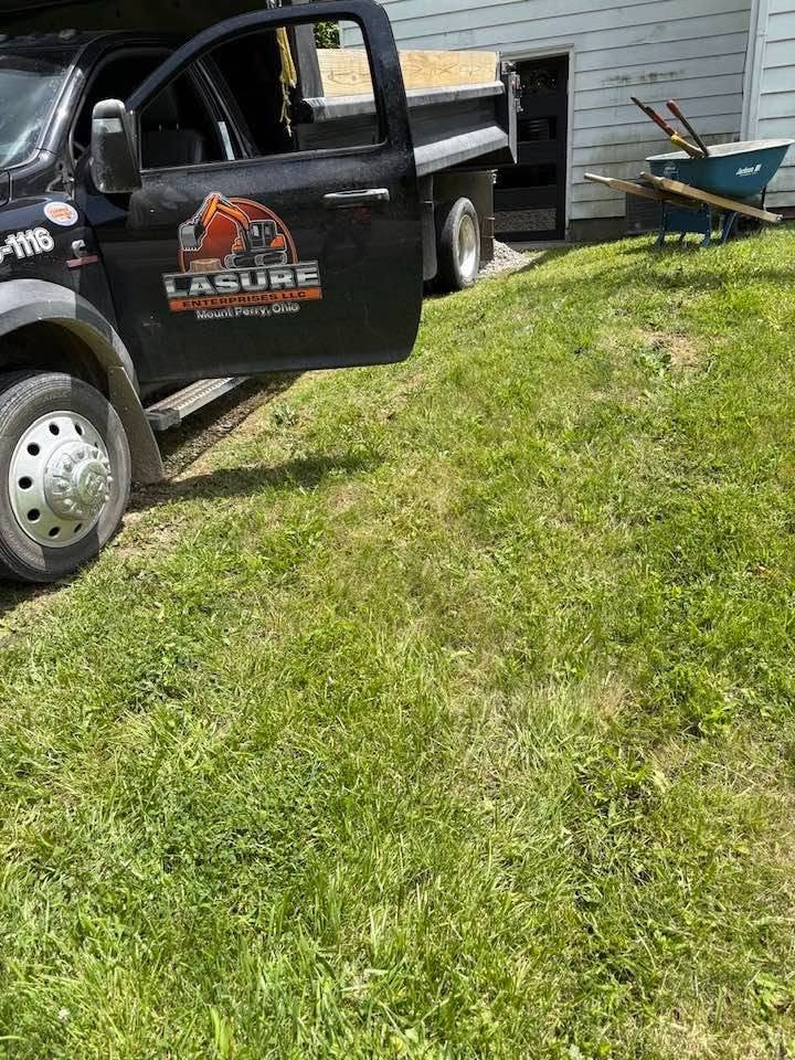 Lasure Enterprises dump truck with custom logo on door
