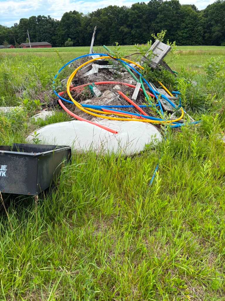 Salvage debris pile before clean up and hauling by Duane